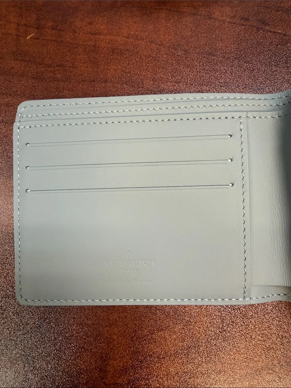 Louis Vuitton Men's Light Grey Pebble Leather Wallet with LV Emblem